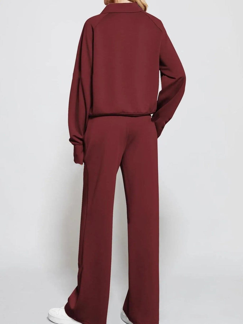 Conjunto de pantalón y top de manga larga con media cremallera