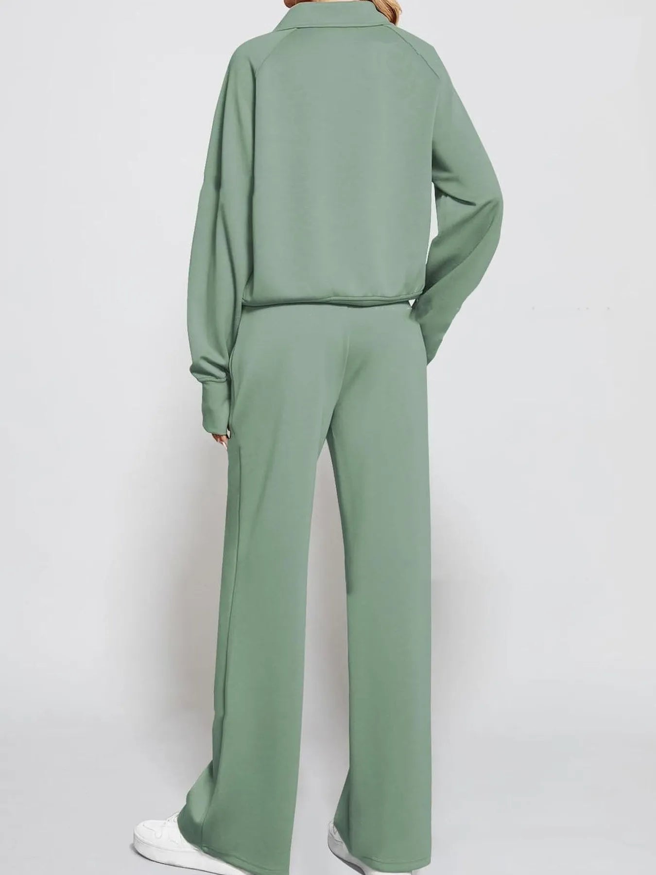 Conjunto de pantalón y top de manga larga con media cremallera