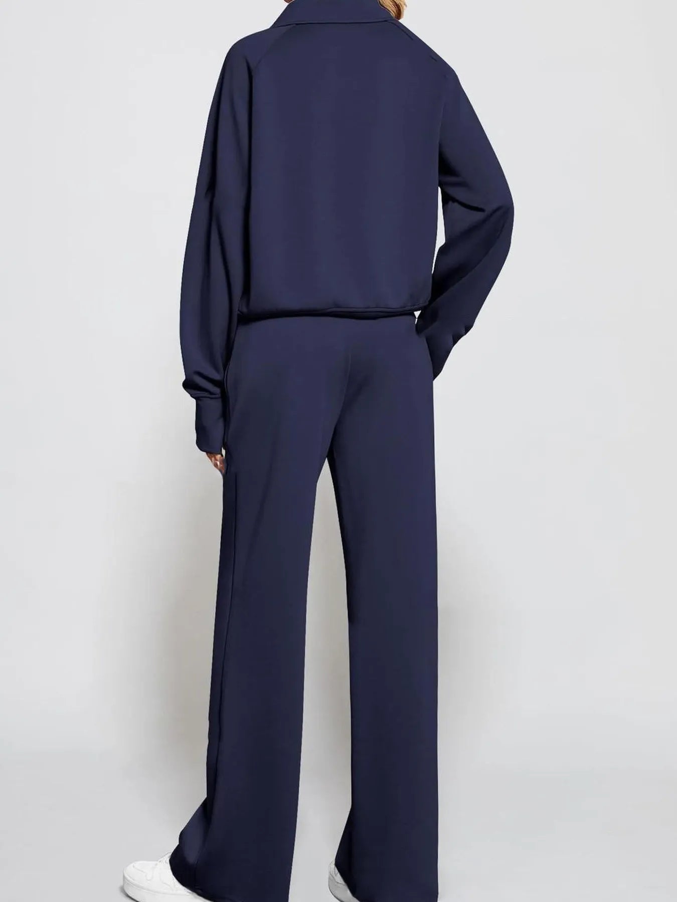 Conjunto de pantalón y top de manga larga con media cremallera