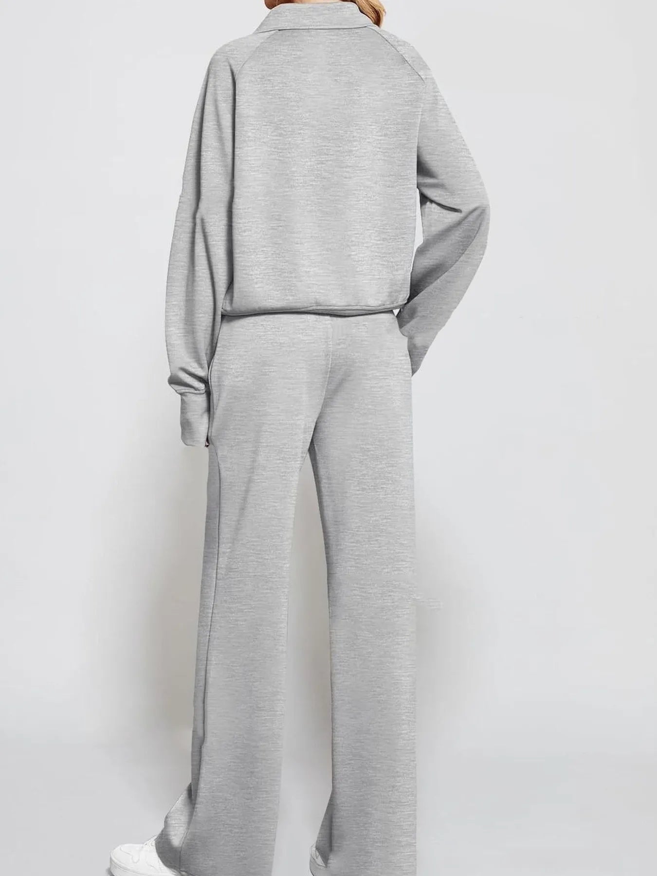 Conjunto de pantalón y top de manga larga con media cremallera